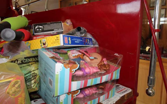 Local fire departments are doing all they can to help provide a merry Christmas for children in need, although toy donations are down about 50% from this time last year, officials said. Joycesarah McCabe | Dispatch Record