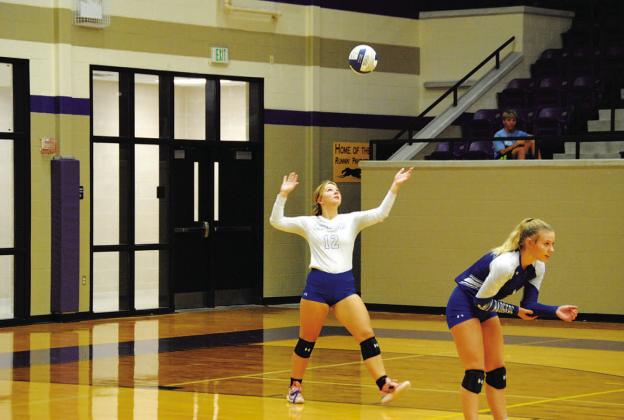 Maggie Fletcher serves as Bre Quarles stands in position against Salado in the playoffs. HUNTER KING | DISPATCH RECORD