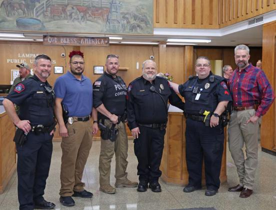 Sgt. Tony Barrio, center, was celebrated at a retirement reception for his years of service to the city. With the officer are, from left, Patrol Lt. Chuck Montgomery, Sgt. Investigator Fidel Morua, Coryell County Constable Guy Bevridge, Lampasas Police Sgt. Steve Sheldon and Police Chief Jody Cummings joycesarah mccabe | dispatch record