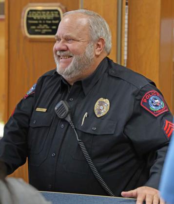 Sgt. Tony Barrio smiles as he speaks with friends and fellow officers at his retirement party Wednesday afternoon. Barrios spent more than 20 years serving the Lampasas community as a law enforcement officer. joycesarah mccabe | dispatch record