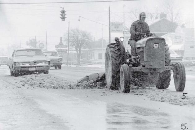 The Lampasas version of a snowplow was utilized to clear the main drag so highway and local traffic could use the roadway. lampasas dispatch photo | january 1973