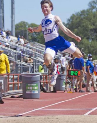 Badger senior Cade White competes in long jump at state on Thursday in Austin. JEFF LOWE | DISPATCH RECORD