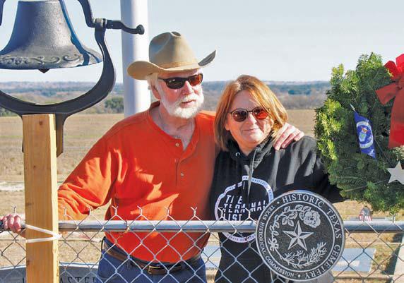 Greg Smith and Tish Casbeer stand behind the newly installed Historical Texas Cemetery medallion that honors Smith Cemetery at School Creek. Smith is the great-great-grandson of Philip Smith who initiated the cemetery in 1854. courtesy photo