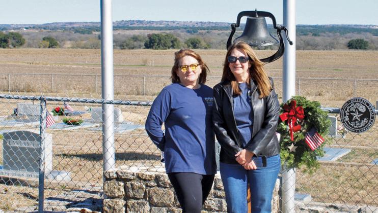 Tish Casbeer, at left, stands with her sister Mary Arnold at Smith Cemetery at School Creek. Casbeer serves as the local Wreaths Across America coordinator. Arnold is co-coordinator and also treasurer for the Smith Cemetery Association. Courtesy photo