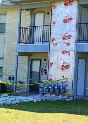 Storm damage included the rock front of the Riverview Apartments building. JOYCESARAH MCCABE | DISPATCH RECORD