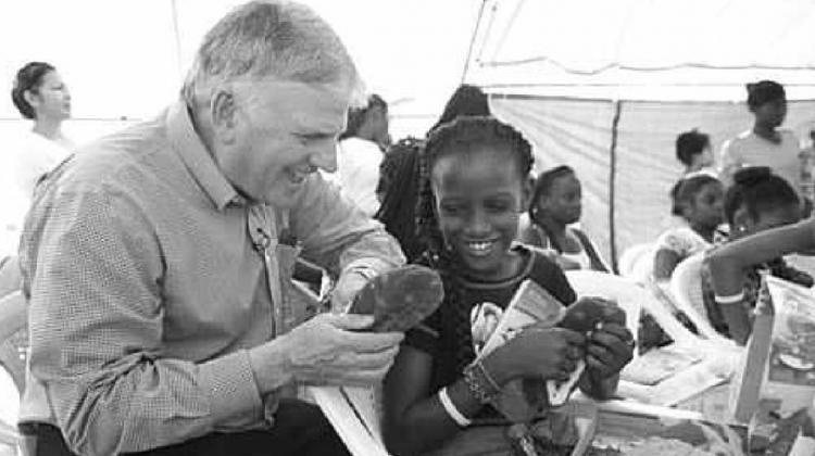 Franklin Graham, at left, is president of Samaritan’s Purse, the sponsoring organization of Operation Christmas Child. The project collects shoebox gifts and delivers them to children in need to demonstrate God’s love in a tangible way. SAMARITAN’S PURSE | COURTESY PHOTO