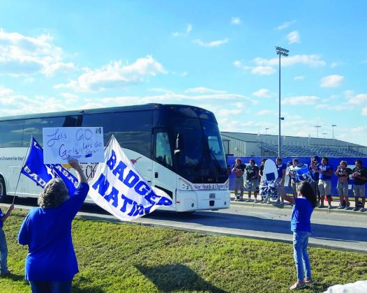 Members of the community and the Badger football team send off the volleyball team to Liberty Hill for their playoff game.