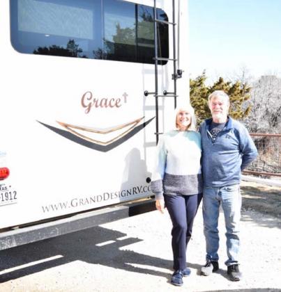 Tim and Kathy McPherson pose by their fifth-wheel RV that they have named “Grace.” ALEXANDRIA RANDOLPH | DISPATCH RECORD