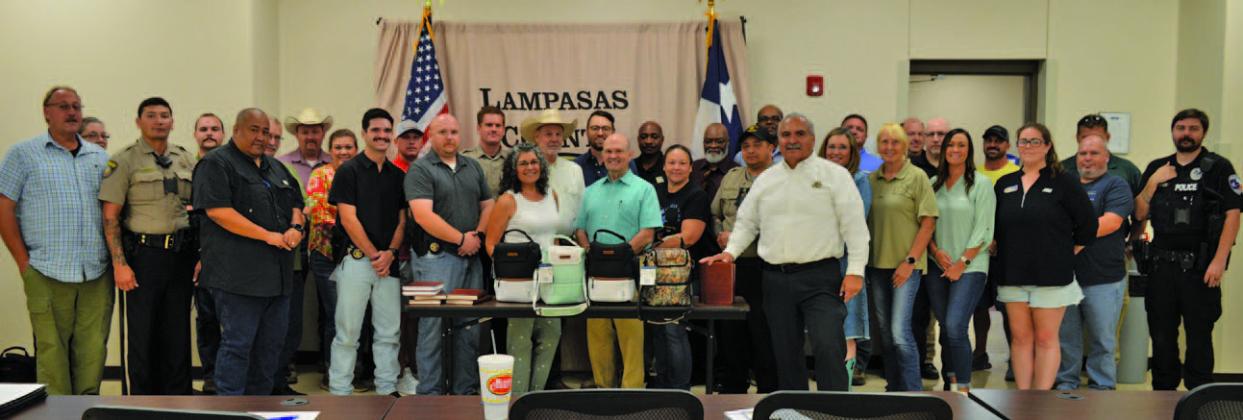 Lampasas County Sheriff’s Office staff stand alongside faith leaders who were recognized at a department meeting last Wednesday. ERICK MITCHELL | DISPATCH RECORD