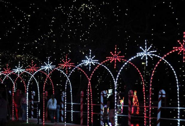 JOYCESARAH MCCABE | DISPATCH RECORD The Candy Cane Lane glitters brilliantly along the creekfront at W.M. Brook Park every year during the Christmas season.