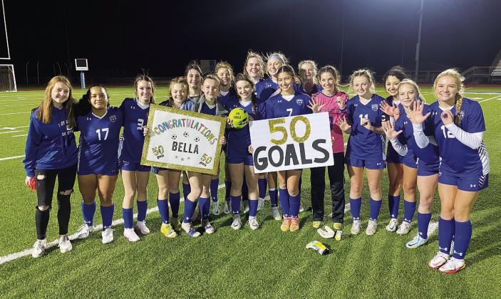 The Lady Badger soccer team celebrates with Bella Lindsey after their win and her 50th and 51st career goals. COURTESY PHOTO