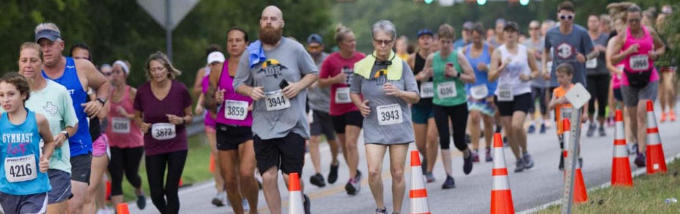 A massive crowd of 350-400 runners competed Saturday in the Spring Ho races, which included 10K, 5K and one-mile routes. JEFF LOWE | DISPATCH RECORD