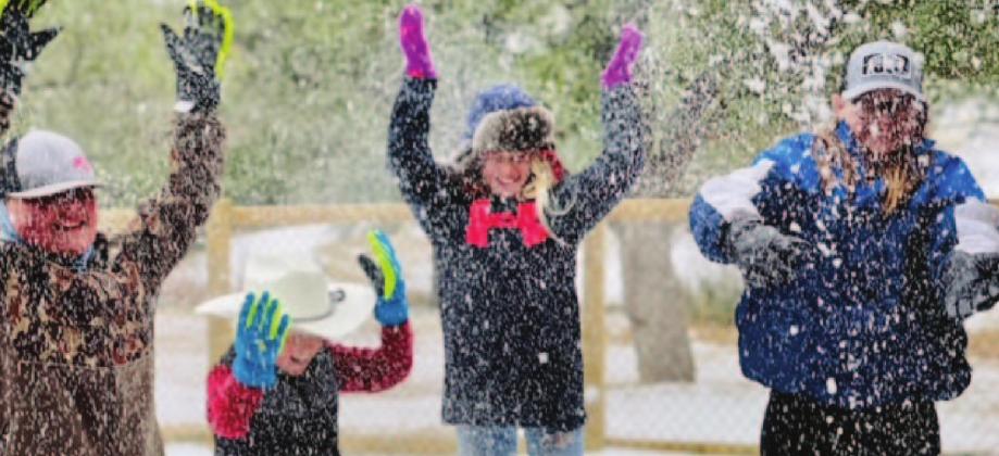 Youth enjoy playing in the snow