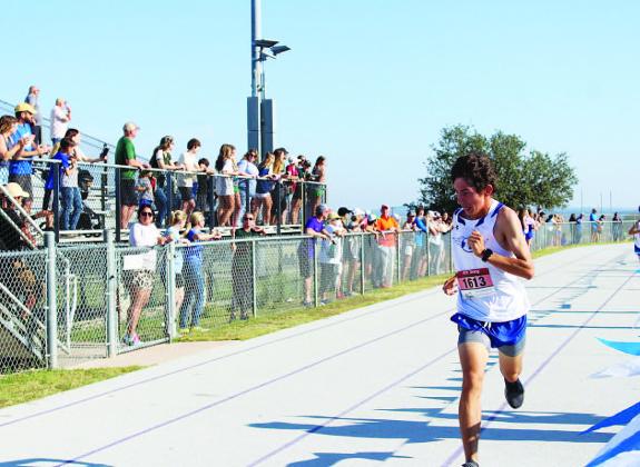Clayton Shaw fights to finish the district race. He and the boys will run at regionals in Huntsville. COURTESY PHOTO