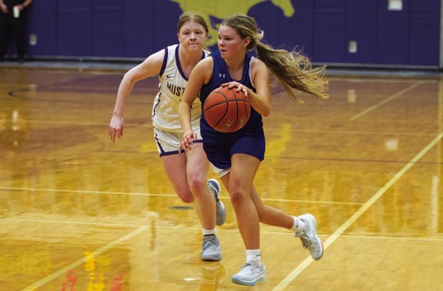 Addison Borchardt drives to the basket during the second half of the game against Marble Falls. HUNTER KING | DISPATCH RECORD