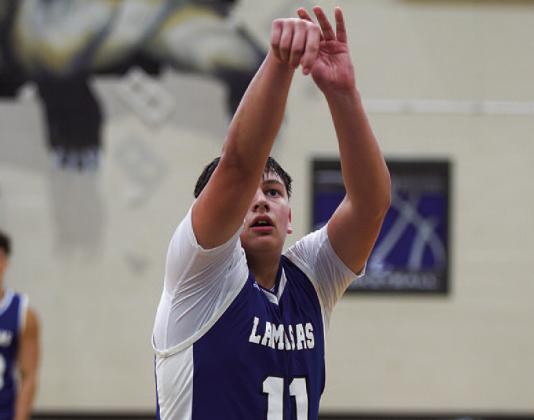 Dylan Polmanteer releases a free throw during Monday night’s game. HUNTER KING | DISPATCH RECORD