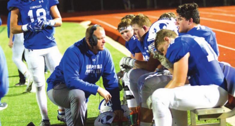 Heath Naragon visits with his offensive line during the 2019 season, when the Badgers went to the state semi-finals. FILE PHOTO