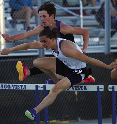 Asa White leaps over a hurdle during the 110-meter race. HUNTER KING | DISPATCH RECORD