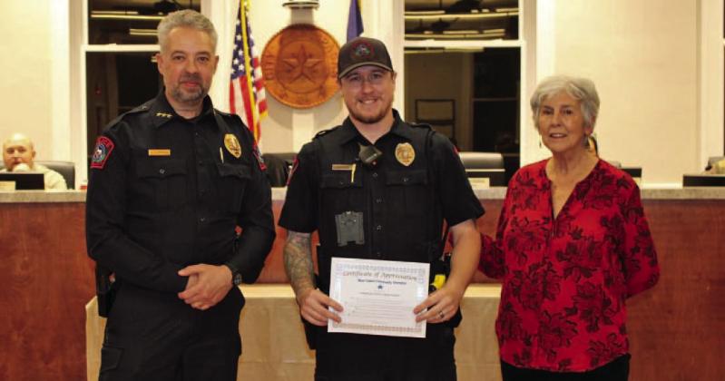 Lampasas Police Department was honored with the December Community Champions award. Chief Jody Cummings and Patrol Officer Dylan Boivin are pictured accepting the award from Lampasas Mayor TJ Monroe. CONTRIBUTED