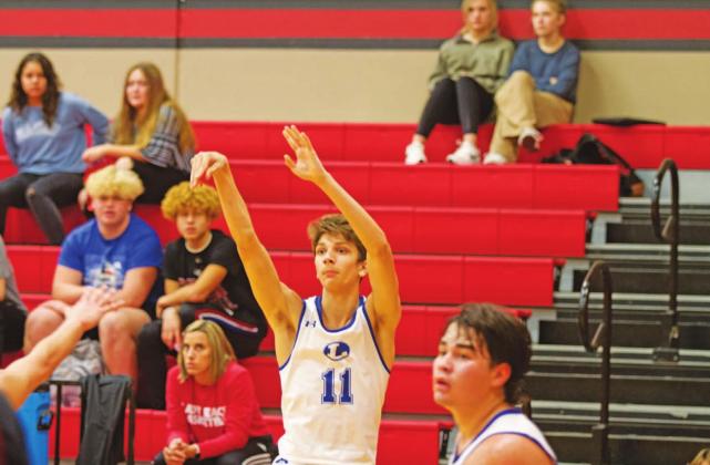 Luke Shivers releases a three-point shot in the Badgers’ game against Bastrop. HUNTER KING | DISPATCH RECORD