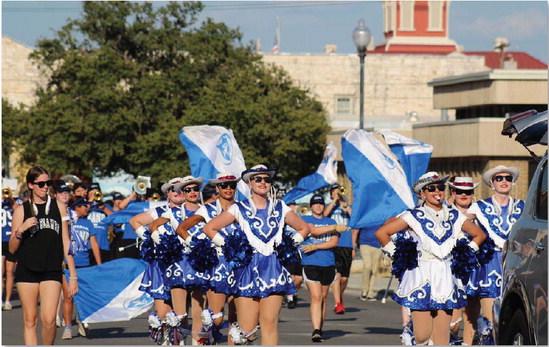 JOYCESARAH MCCABE | DISPATCH RECORD The Lampasas High School Flames march with pride in the 2023 Homecoming Parade.