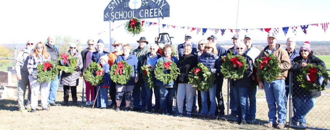 This group gathered at Smith Cemetery at School Creek to place Christmas wreaths on the graves of veterans buried there. ALICE CASBEER | COURTESY PHOTO