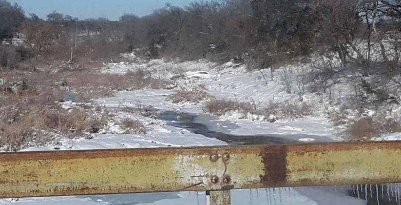 A partially frozen Mesquite Creek just south of Lampasas on U.S. Highway 183 is pictured during the stretch of extreme weather from Feb. 9-19, 2021, when the mercury stayed below 32 degrees for 10 consecutive days. FILE PHOTO