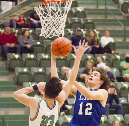 Landon Mulcahy (12) scored nine points in the fourth quarter in a close win over Burnet. JEFF LOWE | DISPATCH RECORD