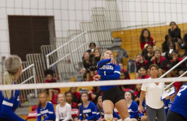 BreAnna Quarles finishes on a spike during the Lady Badgers’ first game against Harker Heights. HUNTER KING | DISPATCH RECORD
