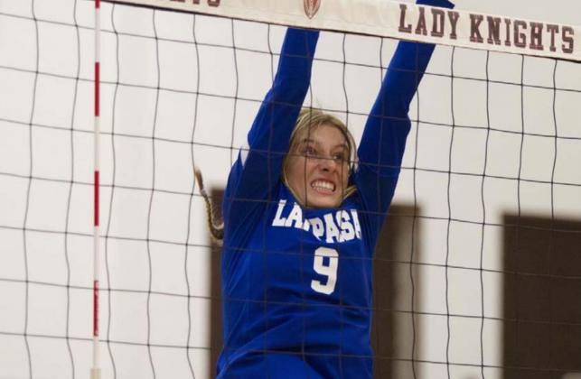 Cobie Chandler goes up for a block during the Lady Badgers’ match against Harker Heights. HUNTER KING | DISPATCH RECORD