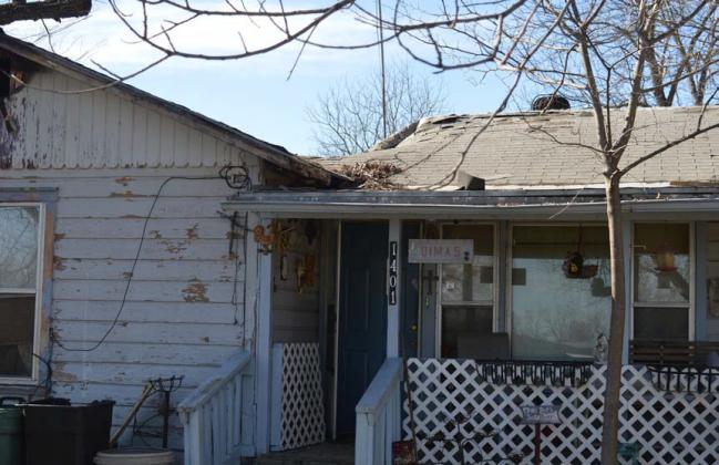 erick mitchell | dispatch record Three people were displaced after a fire significantly damaged a home in the 1400 block of East Third Street on Monday morning.
