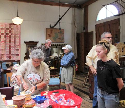Museum board member Sherry Boultinghouse, at left, serves up ice cream for those in attendance at Friday’s ceremony to recognize the 150th anniversary of the city’s incorporation. The Texas Legislature recognized the creation of Lampasas on April 21, 1873. JOYCESARAH MCCABE | DISPATCH RECORD