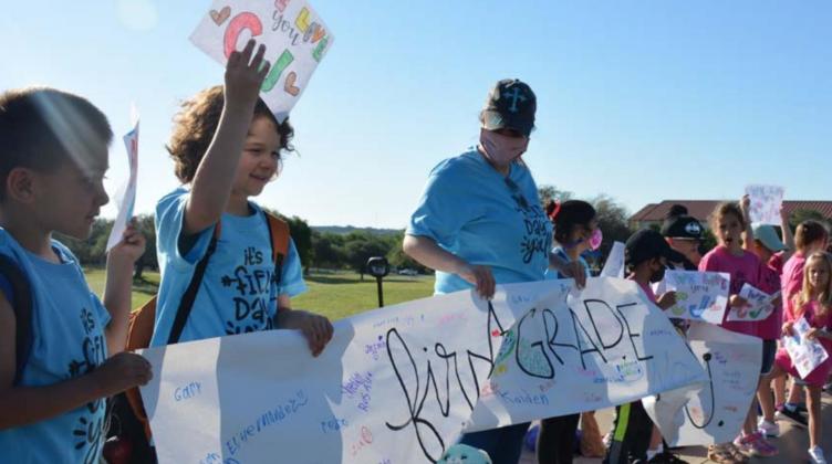 CJ’s classmates and teachers greeted him with signs Thursday morning. MONIQUE BRAND | DISPATCH RECORD