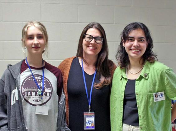 veronica butler| dispatch record Sophomore Daphne Davenport, left, and senior Tate Brown, right, stand with art teacher Judith Brown before the state competition. Color photos of their art can be viewed at the Dispatch Record website and in the online edition.