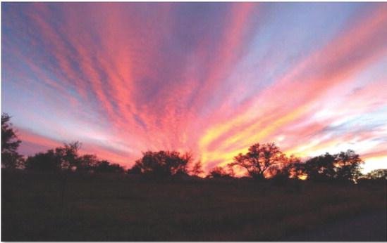 Brilliant colors streak across the sky, as the sun dips below the horizon on a recent November evening. COURTESY PHOTO