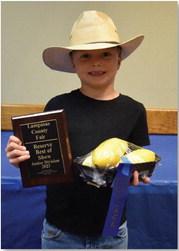 ALEXANDRIA RANDOLPH | DISPATCH RECORD Rollo Purdy won junior champion in horticulture with his yellow squash.