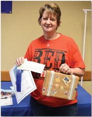 Ellen Schriver won adult champion of the theme category with her Spring Home suitcase. ALEXANDRIA RANDOLPH | DISPATCH RECORD