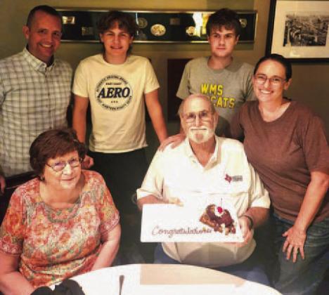 Family members surprised Steve “Doc” Forsythe with a congratulatory dessert to celebrate his honorary recognition by the Texas FFA Association. On the front row with Forsythe are his wife, Cynthia, at left, and daughter, Mary Forsythe Buzzell; at back are son-in-law David Buzzell, and grandsons Keegan Buzzell and Camden Buzzell. COURTESY PHOTO