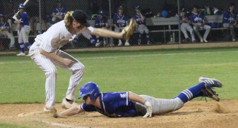 Gauge Gholson slides into first base in a previous district game. Gholson reached base twice against Stephenville, the district leader, on Tuesday. CHRIS YBARRA | DISPATCH RECORD