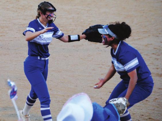 Hadley Oncken, left, runs to hug Alycia Cantu after the final out was recorded to beat Graham. HUNTER KING | DISPATCH RECORD