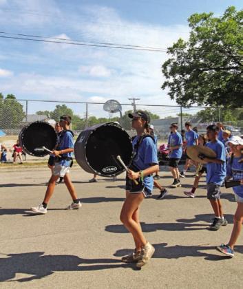 JOYCESARAH MCCABE | DISPATCH RECORD The Lampasas High School Badger Band marches with enthusiasm despite the warm temperatures at parade time last Saturday.