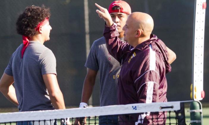 Coach Frank Reyes III gives instructions to Jaimes and Caso Prado during a break in action. JEFF LOWE | DISPATCH RECORD
