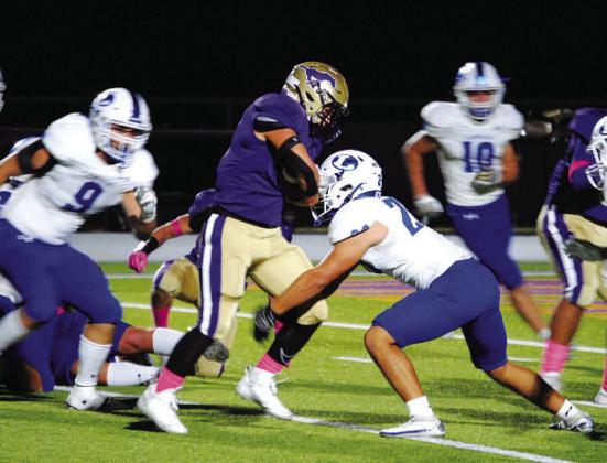 Levi Rivera makes the tackle on the Marble Falls runner. HUNTER KING | DISPATCH RECORD