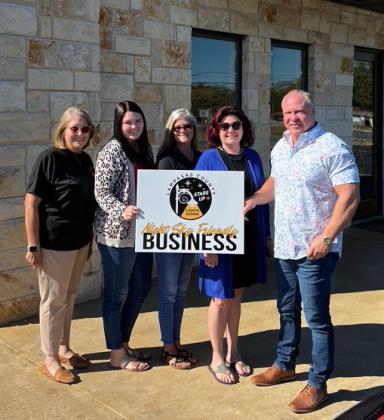 Lampasas County Friends of the Night Sky business liaison Martha Noell, at left, is pictured with Harrell &amp; Associates team members, left to right, Bailey Oldham, Evette Bowen, Jamie Garrett and owner Jack Harrell, whose firm received the Night Sky Business Award. courtesy photo