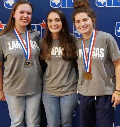 Lydia Breuer, left, and Amelia Stanley, at right, stand with the LHS newspaper adviser and UIL coach Kayla Cain after placing at the state meet. VERONICA BUTLER | DISPATCH RECORD