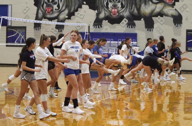 The Lampasas High School Lady Badger volleyball team goes through their warm-up routine before practice on Tuesday. ERICK MITCHELL | DISPATCH RECORD