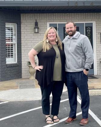 Courtney and Zach Carnley stand in front of Viss Family Funeral Home in Copperas Cove. The couple are new owners of the business, which will become the second location for Sneed-Carnley Funeral Chapel and Cremations. COURTESY PHOTO