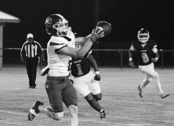 COURTESY PHOTO Easton Hamilton looks in a pass from Ulises Caso-Prado during Lometa’s win on Friday. TESY
