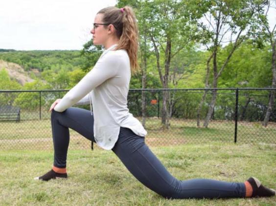 From a lunge position, as shown above, focus on pressing the pelvis toward the ground. This “upright lizard pose” can help stretch the hip flexors. COURTESY PHOTO