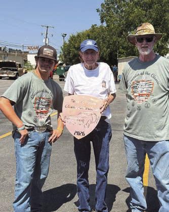 James Kincheloe, center, shows off the plaque he received at the annual Classics at the Classic Car Show. The show for next year is planned for Sept. 11, 2027. COURTESY PHOTO
